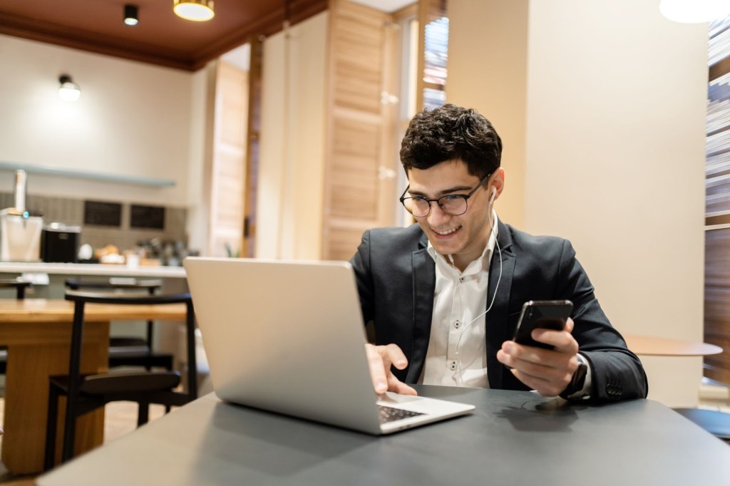 Shaun working remotely from a coworking space and enjoying his focused and structured way of dealing with workplace stress.
