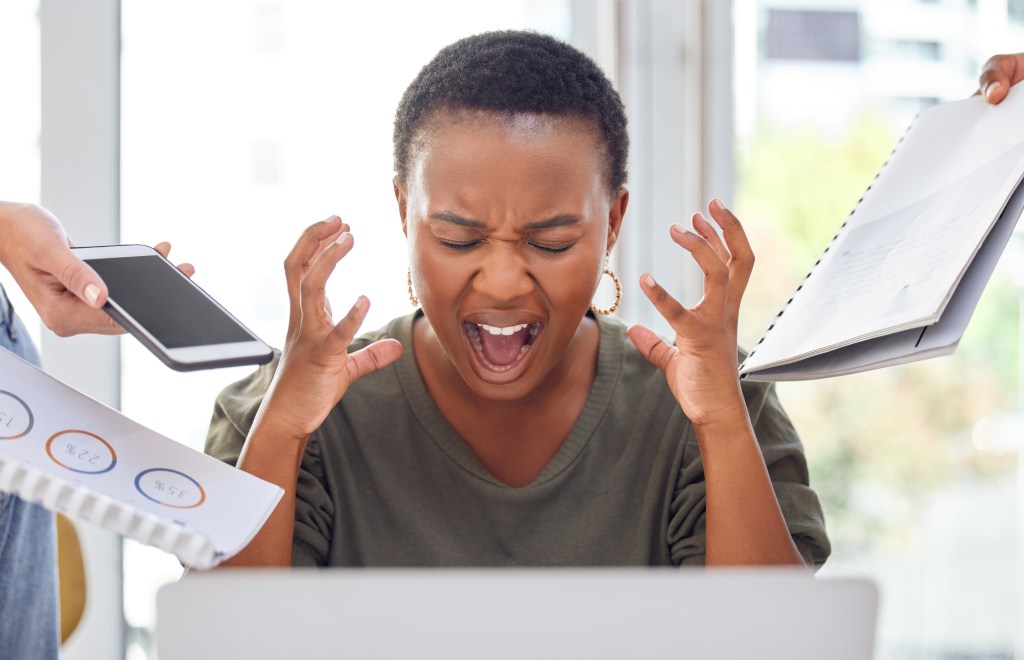 Shot of a businesswoman looking stressed out and overwhelmed in a demanding job where performance is the only focus and well-being is neglected.