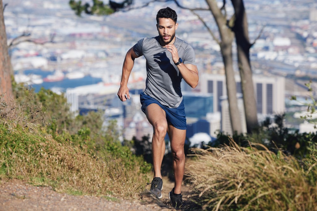 Young male professional taking a quick city run to disconnect from work and build up his exercise routine