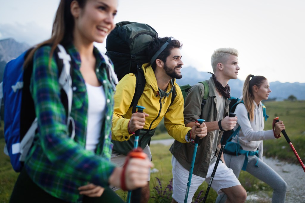 Group of friends hiking in nature enjoying each other's company while getting light exercise done