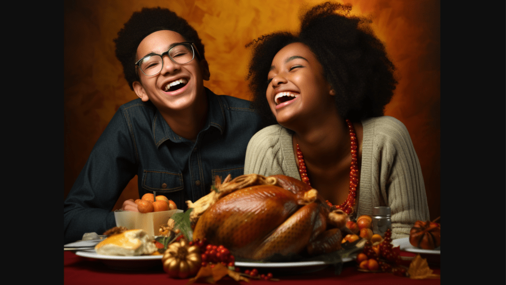 Laughing holiday anxiety away: A male and a female Afro-American student sitting at the Thanksgiving Dinner, having a great time in the face of chaos.