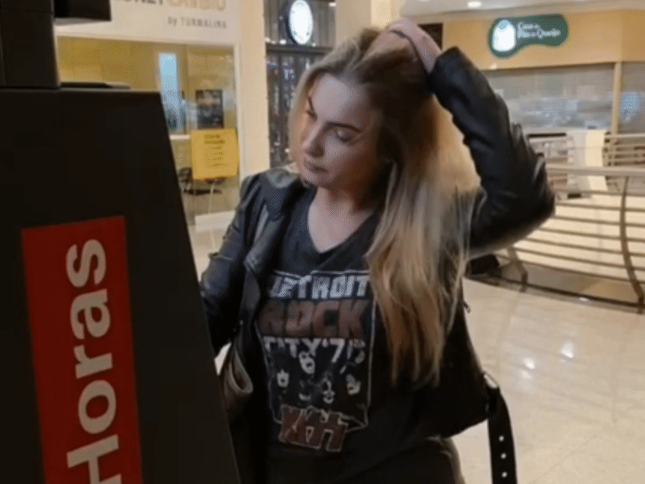 Financial fear: Young blond woman in a mall feeling desperate at the ATM because she there's no money left on her account. Her paycheck did not get in in time and she feels the pressure.