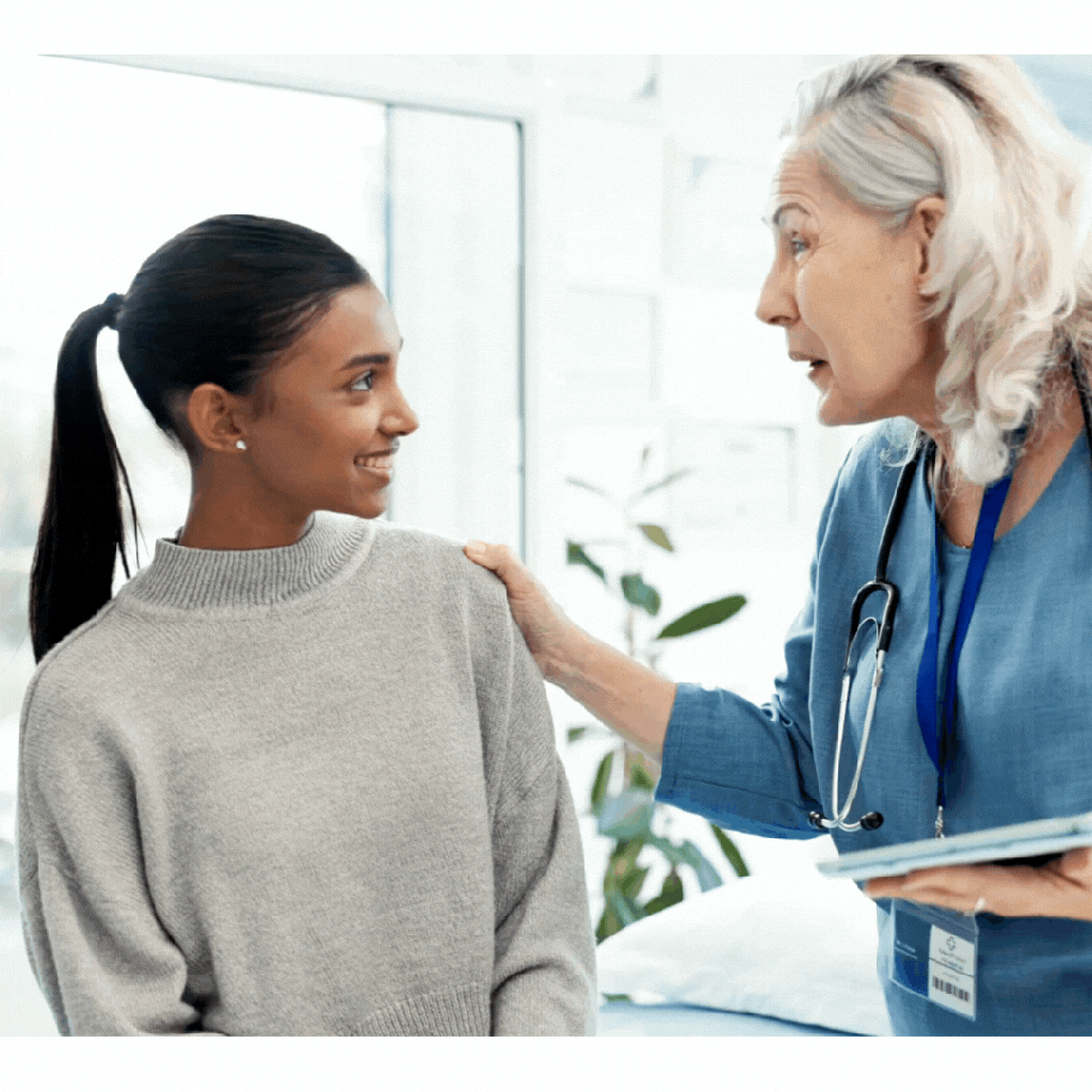 Female health care professional holding a tablet and congratulating young female patient on data-driven progress with her well-being efforts
