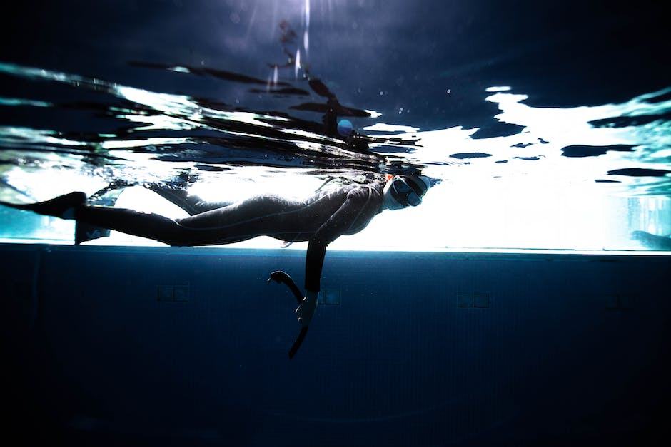 Young woman peacefully snorkeling in deep blue waters. Rhythmic exercises, such as swimming, can have a profound meditative effect on the mind.