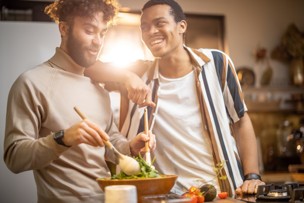 Combatting high functioning depression with a ritual: Caucasian and hispanic male roommates cooking healthy food to disconnect from work