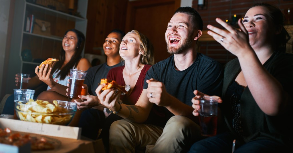 Group of five friends having fun with a movie night during to combat heat waves