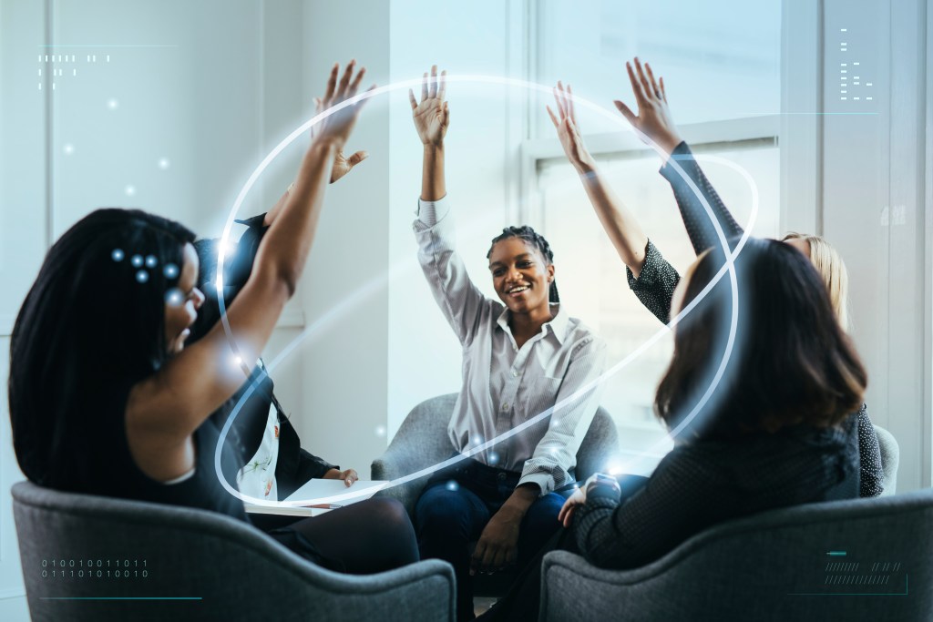 Support system activated: businesswomen putting hands in the middle