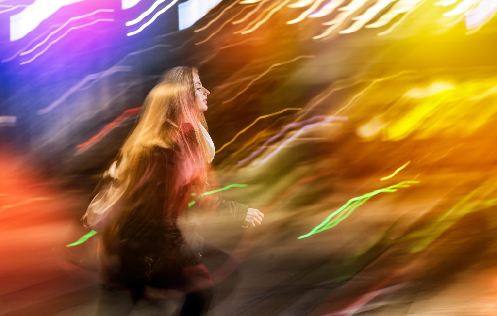 Wondering how to heal disorganized attachment in a relationship: Woman in the city at night 