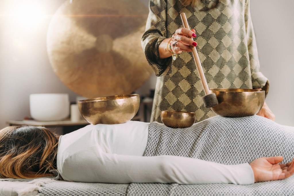 Danger of sound healing side effects: woman in sound therapy