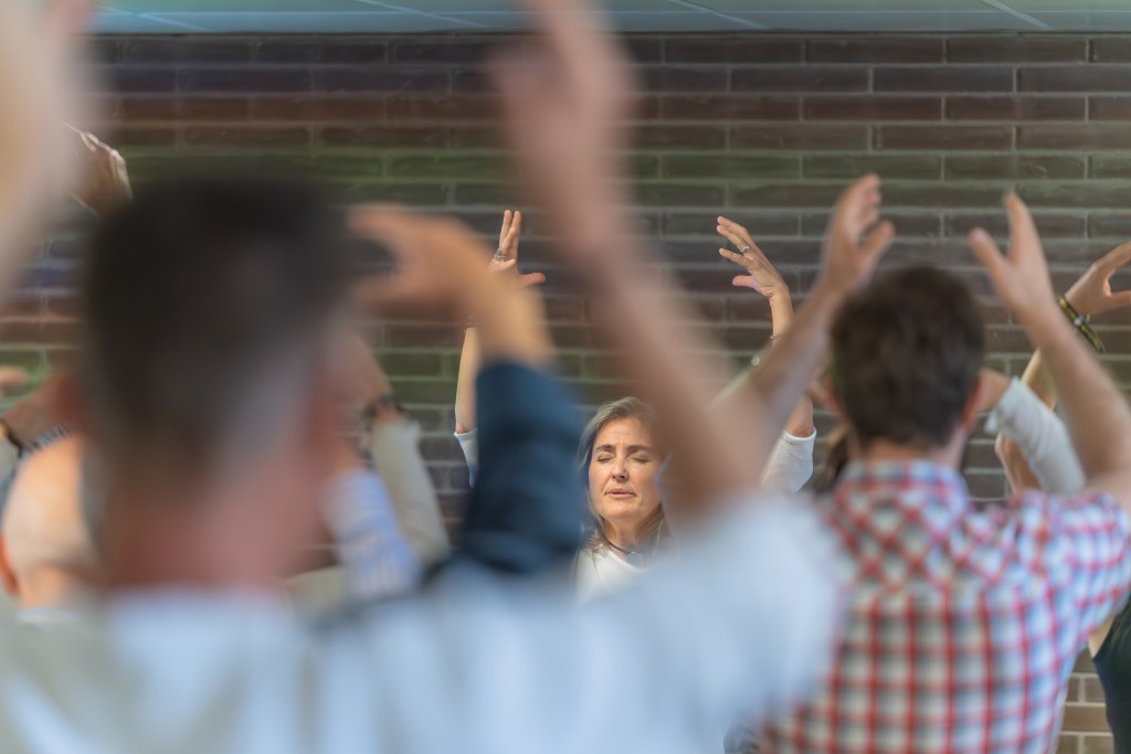 Signs You’re in a Cult: Energetic healer doing a healing class.