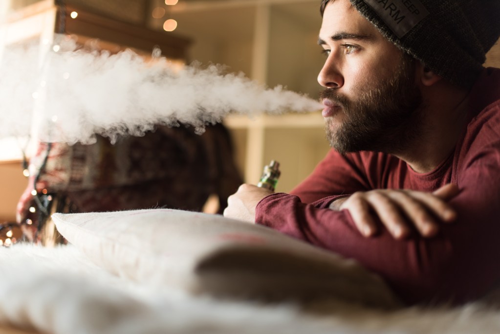 Man vaping and trying to quit with the help of urge surfing