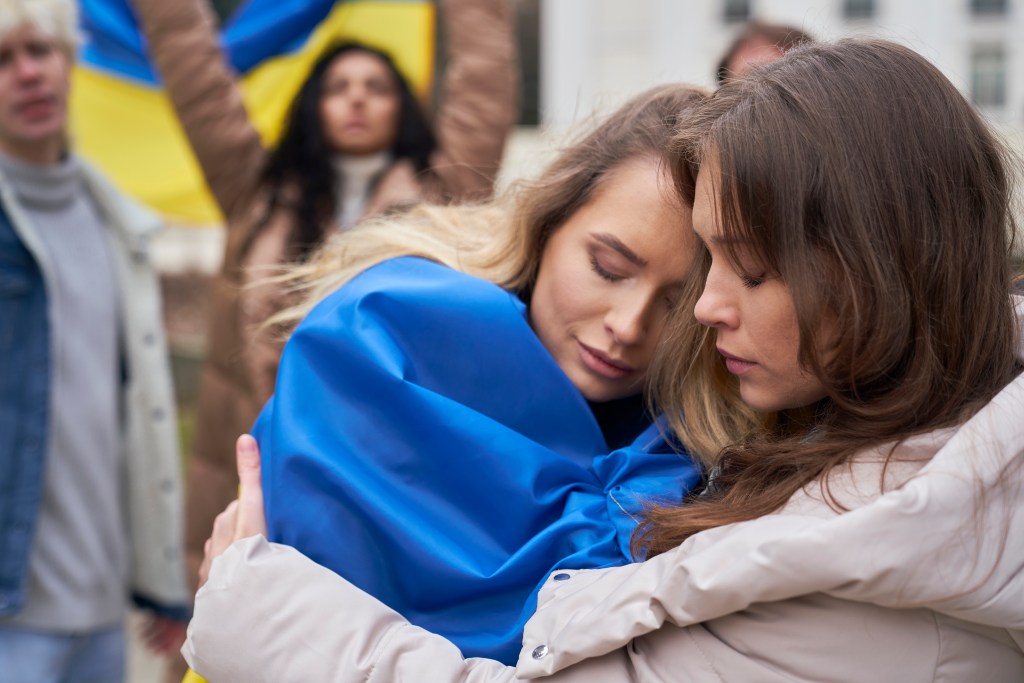 Healing from trauma quotes: Ukrainian women comforting each other through their emotional pain