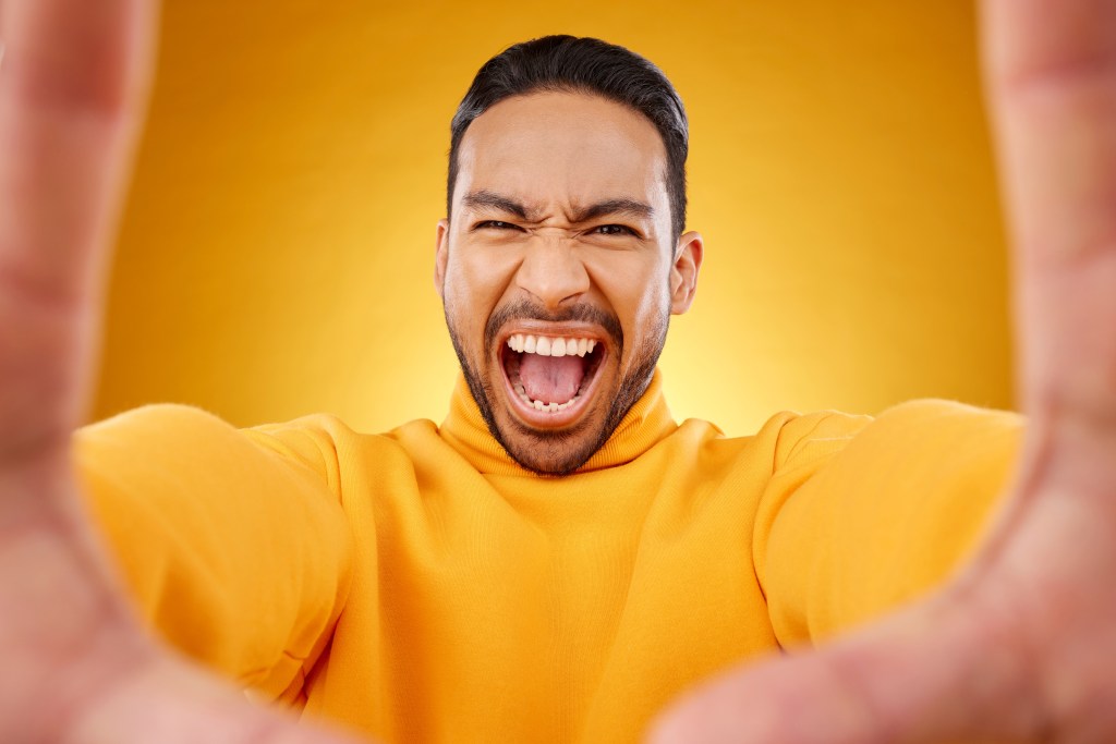 Man expressing his intense emotions by responding with strength drawn from daily affirmations