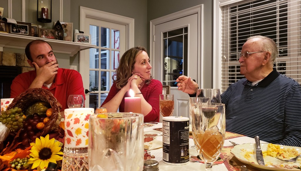 Toxic family members having dinner: Grumpy uncle, skeptical man and woman faking interest