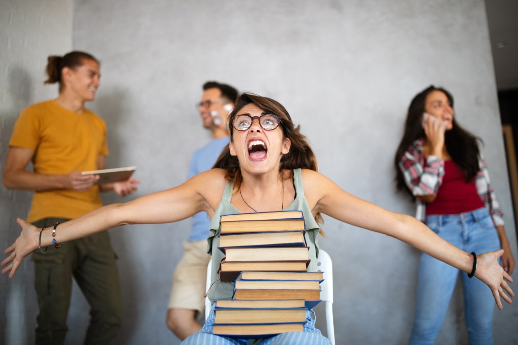 Student freaking out, overwhelmed by academic stress and exam anxiety