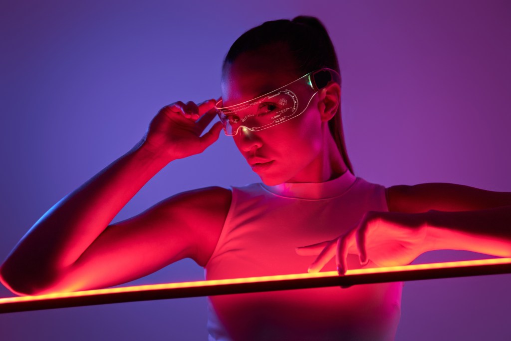 Woman wearing futuristic light therapy glasses to supplement her exposure to daylight during winter