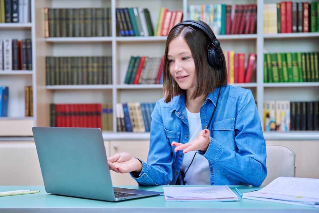 Student working with an English AI tutor for international students to improve her mental health. 
