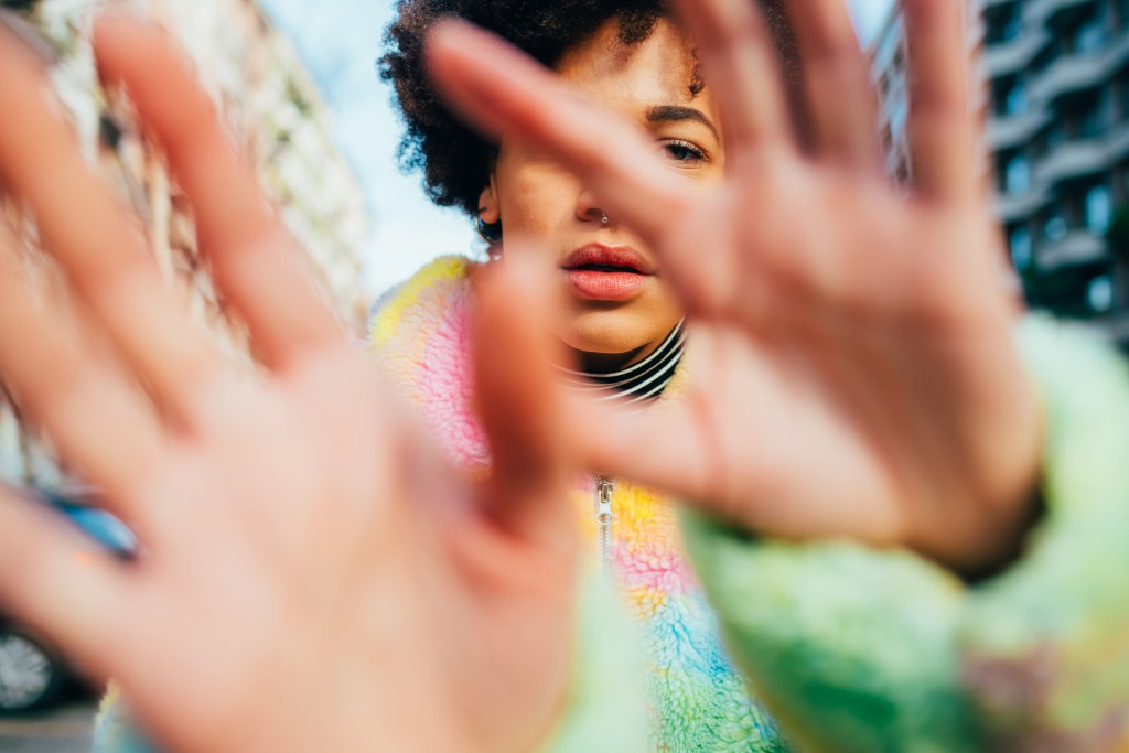 Fear of dogs: Woman trying to protect herself from perceived threat