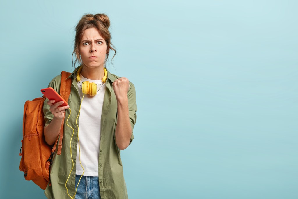 Student frustrated because scrolling keeps sabotaging her daily learning aims
