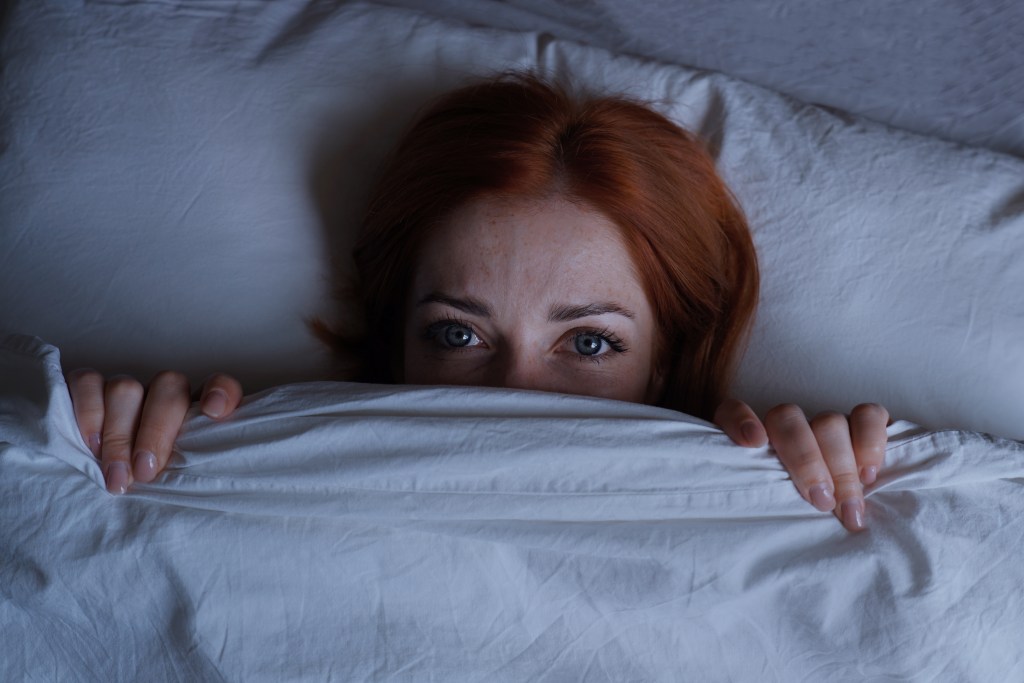 Woman unable to sleep, hiding under sheets dreading her case of a sexual abuse lawsuit