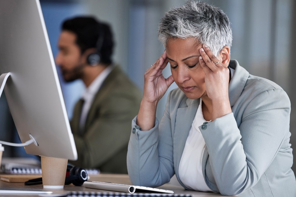 Mature professional struggling with stress and anxiety that is rooted in the so-called mobility trap