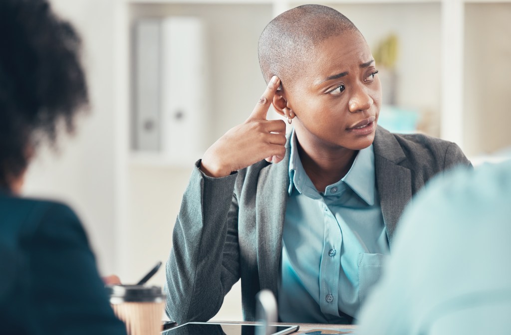 What's wrong with me? Pensative woman at work, sensing something is off with her mental and physical health